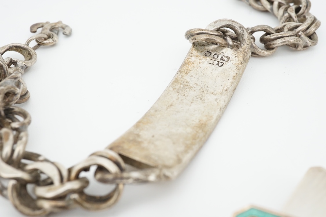 A 1970's silver identity bracelet and a modern pair of silver and two colour enamel cufflinks.